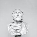 bust of ancient philosopher on grey background