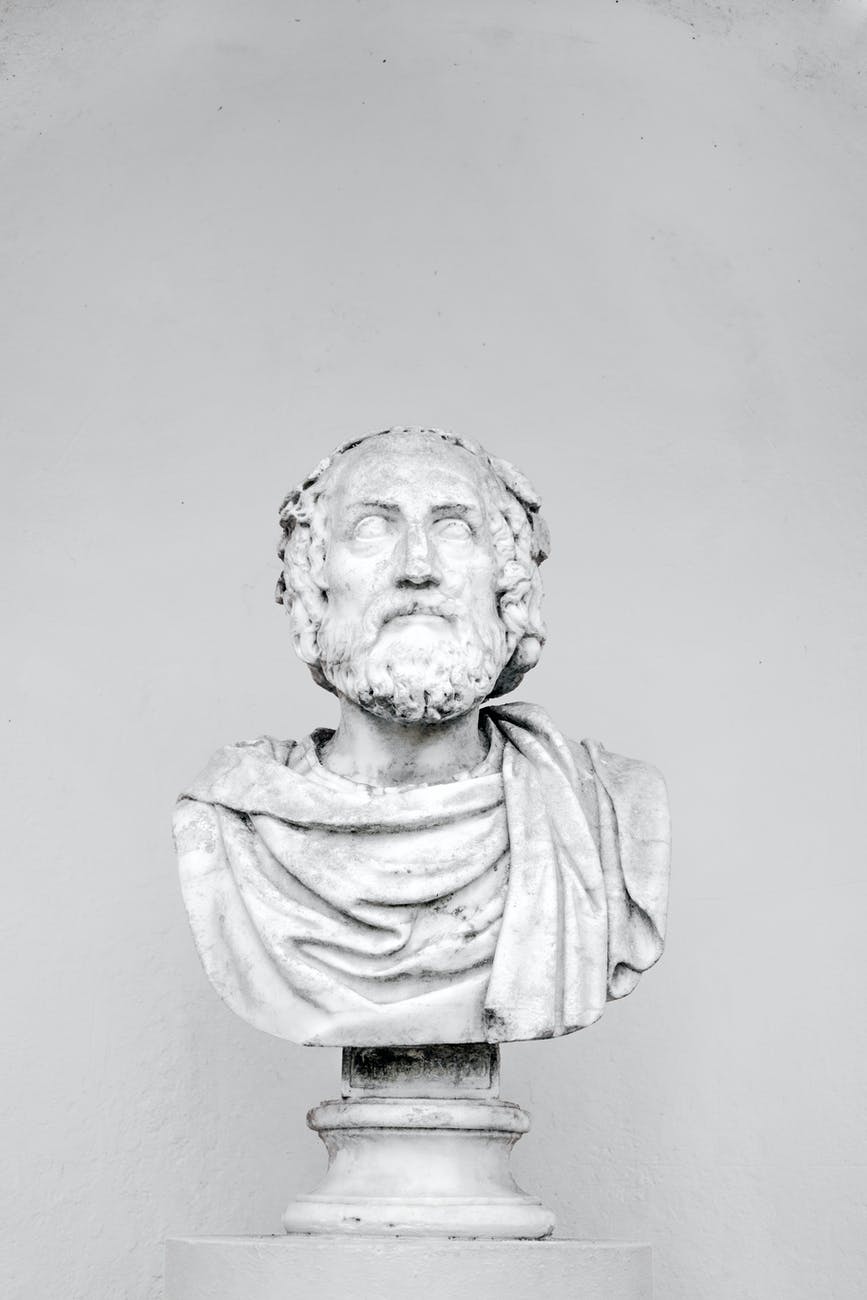 bust of ancient philosopher on grey background